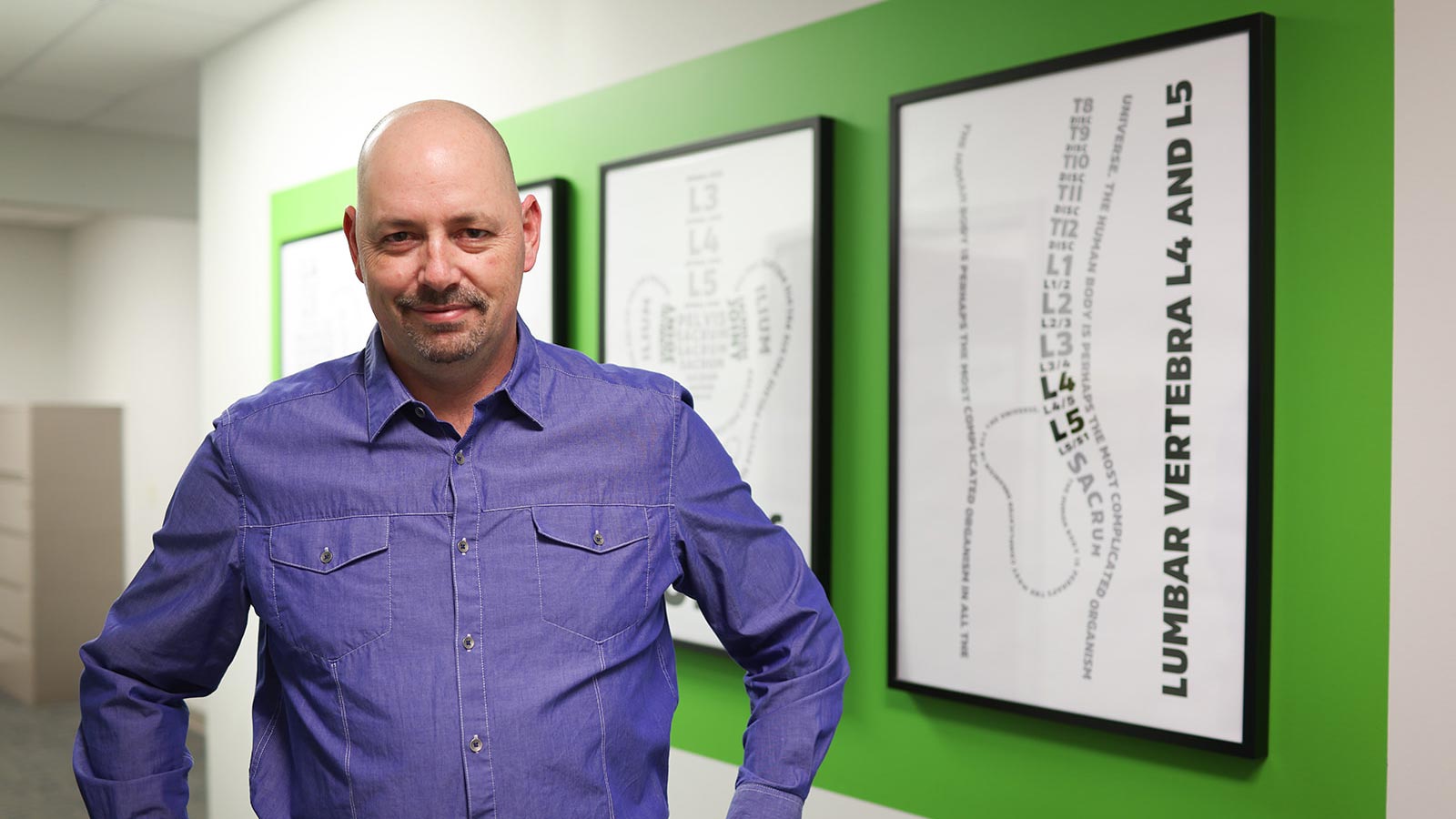 Dr. Sean M. Wheeler, M.D., in the Body Guitar Clinic hallway